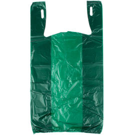 I sacchetti della spesa di drogheria di colore verde, maglietta di plastica insacca rispettoso dell'ambiente